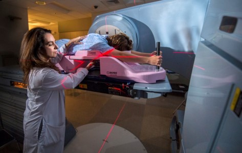 Dr. Joana Emmolo works with a patient.