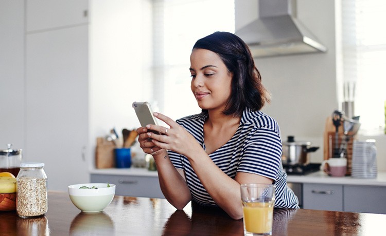 Woman uses Atlantic Anywhere app on phone