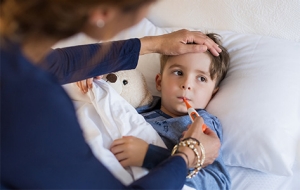 Mom takes son's temperature