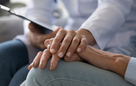 A caring hands during a clinical trial.