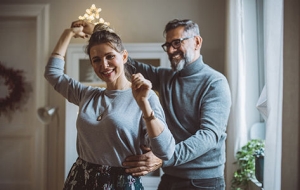 middle aged couple dancing together