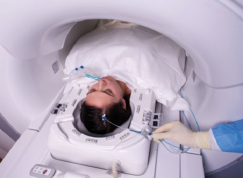 Patient receiving LITT, minimally invasive surgery, for brain tumor.