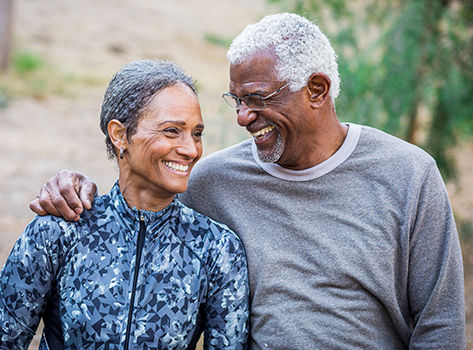 Smiling man and woman hugging