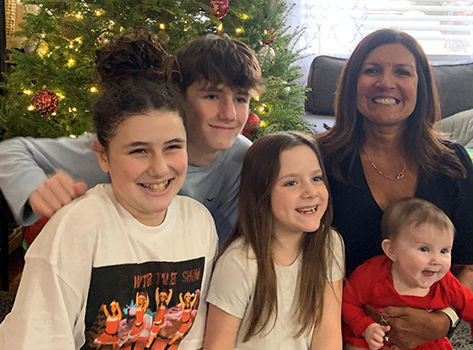 Photo of Nancy P. with family at Chirstmas