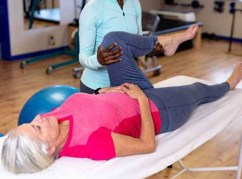 A woman receives physical therapy for osteoarthritis.