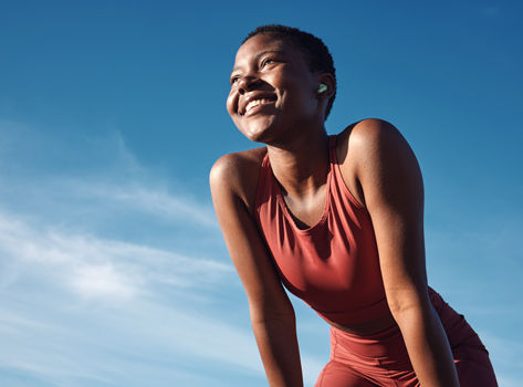 An athletic young woman prepares for exercise.