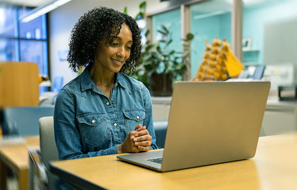 Patient participates in a remote support group session on her laptop.