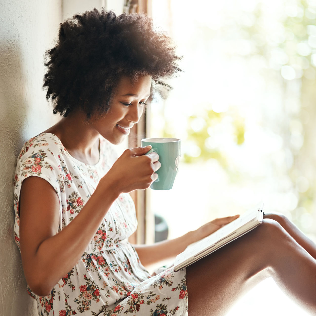 A mature woman smiles peacefully.