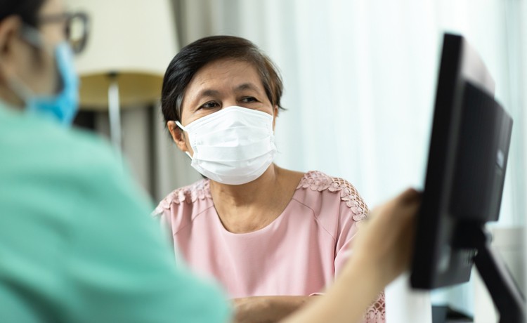 A financial counselor reviews payment options with a patient.