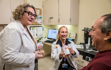 Tom Thomas, MD, scoping a patient