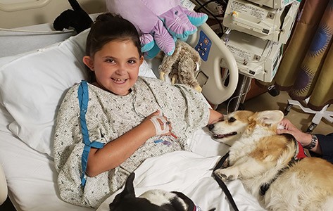 Goryeb brain tumor patient with pet therapy dog