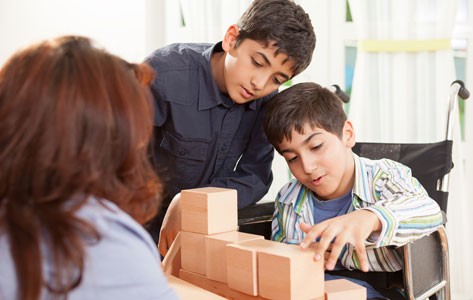 Boys working with building blocks