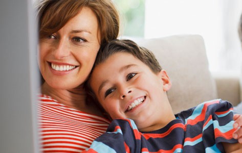 Pediatric pulmonary patient smiling with his mother