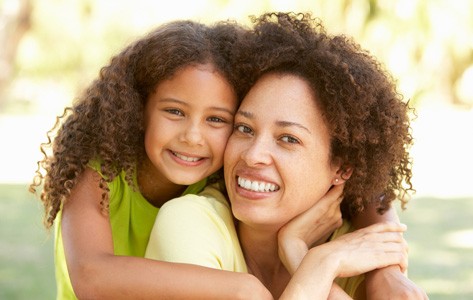 Daughter hugging mother