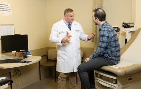 Matthew Martinez, MD, with a patient