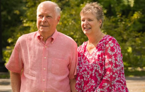 Christene walks with her husband. After surgery, she's able to walk with ease and has much more energy to play with her young granddaughters. 