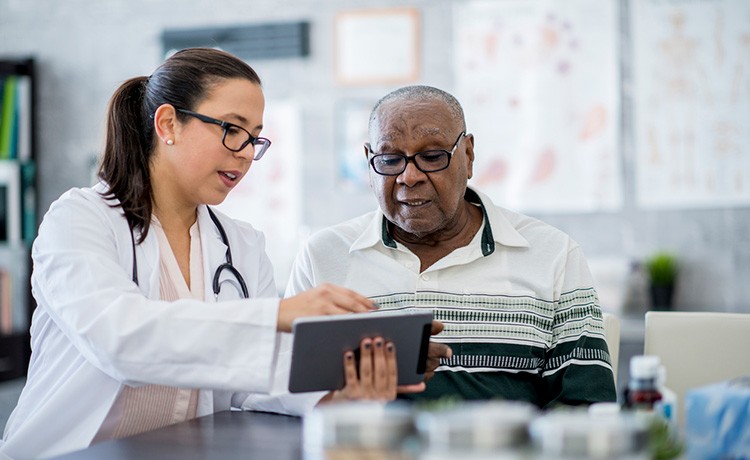 Doctor reviews neuroscience resources with patient