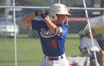 R.J., 14, steps up to bat during a baseball game.