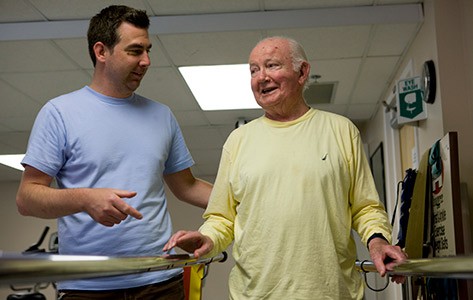 Physical therapist conducts balance therapy with patient