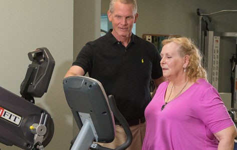 A physical therapist works with Nancy on exercises to improve strength and agility.