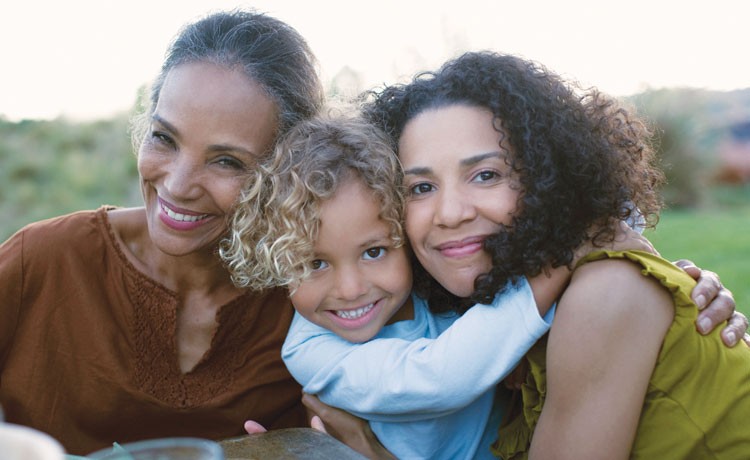 Generational women hugging