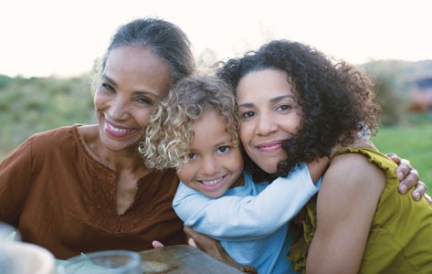 Generational women hugging