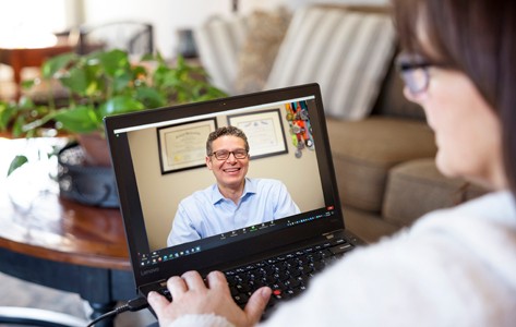 woman watching live webinar