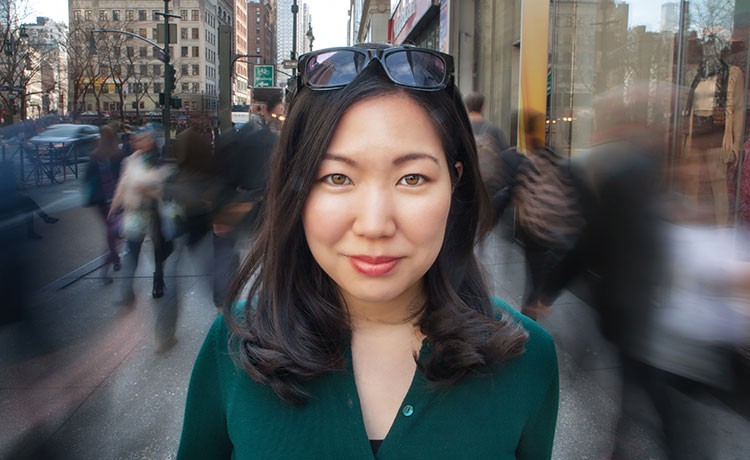 Asian woman walking in the city