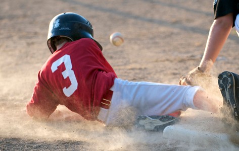 child sliding into third base