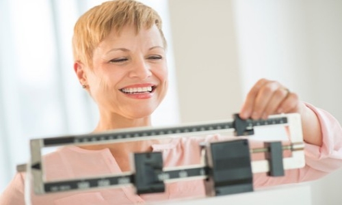 woman weighing herself