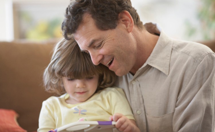 father reading to child