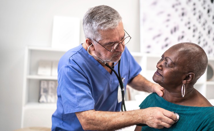 Doctor checking patient with stethoscope