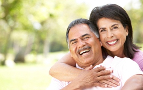 Woman hugging man