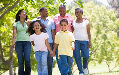 African American family walking in the park