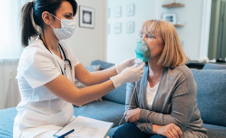 women receiving breathing treatment