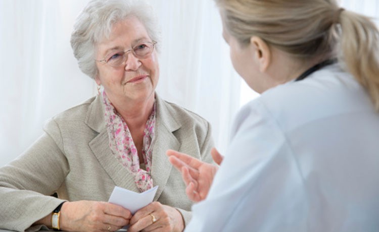 Doctor talking to older patient