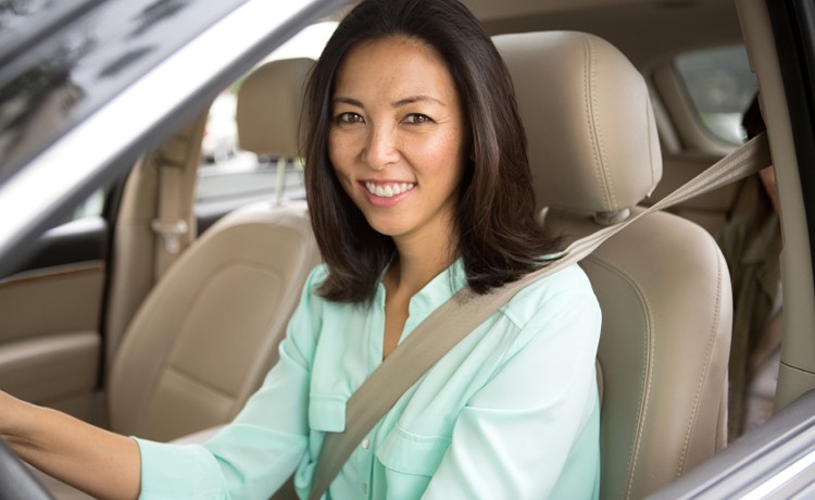 Asian couple driving