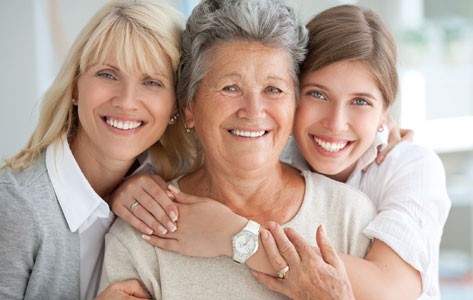 Generational women hugging