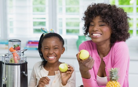 Kids eating fruit