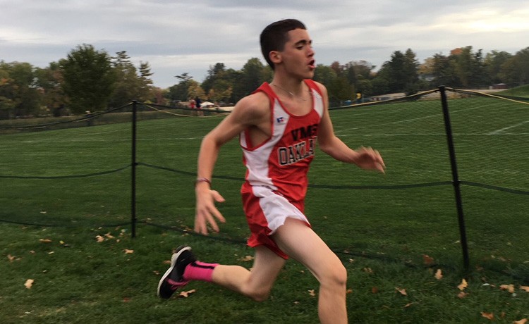 Dominic competes in track and field